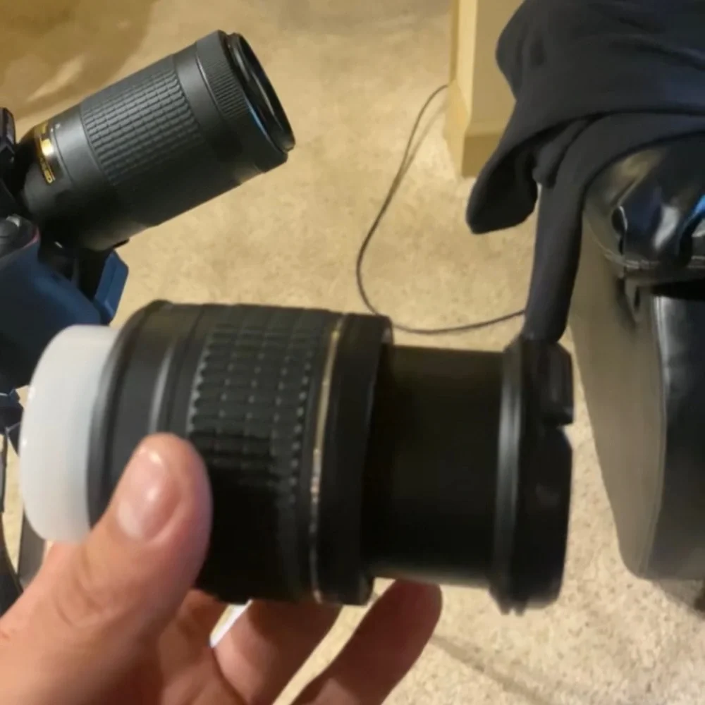 Nikon D3400. Comes with camera, lenses, camera case, battery charger, and tripod